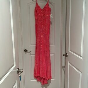 Beautiful neon pink prom dress from Windsor. New with tags size medium.